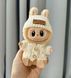 Игрушка фигурка-брелок Labubu Лабубу в одежде сидящая 12см, дизайн ассорти 1222